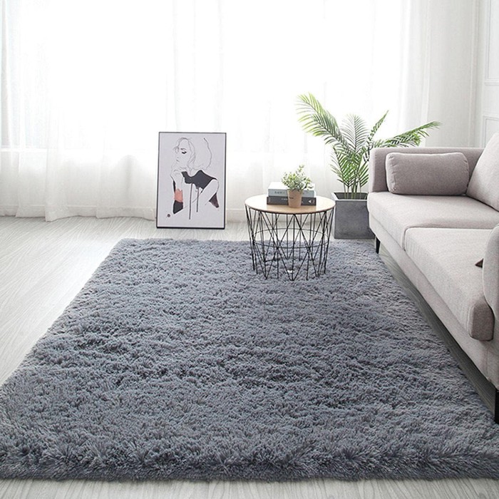 Como combinar cor do tapete com o sofá na decoração da sala
